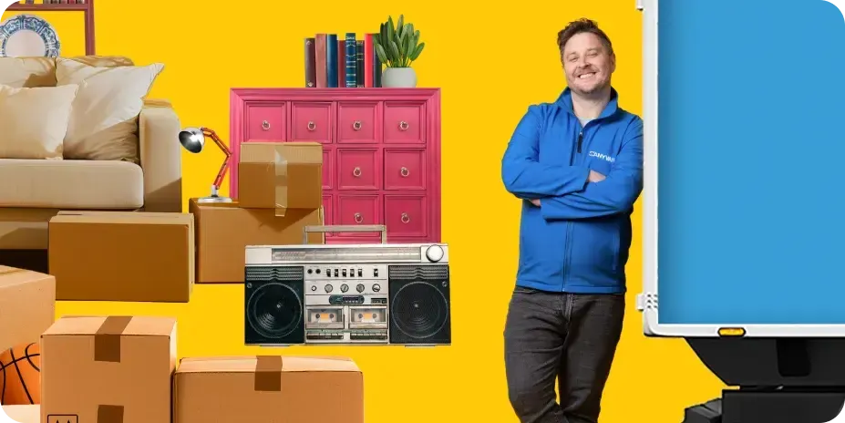 Image of furniture and moving boxes with a moving expert